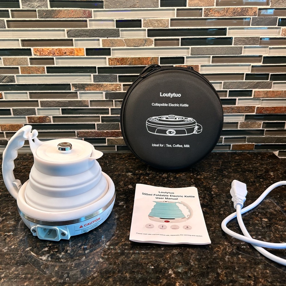 electric travel kettle collapsable 
Brand new 
Great for tailgating & camping